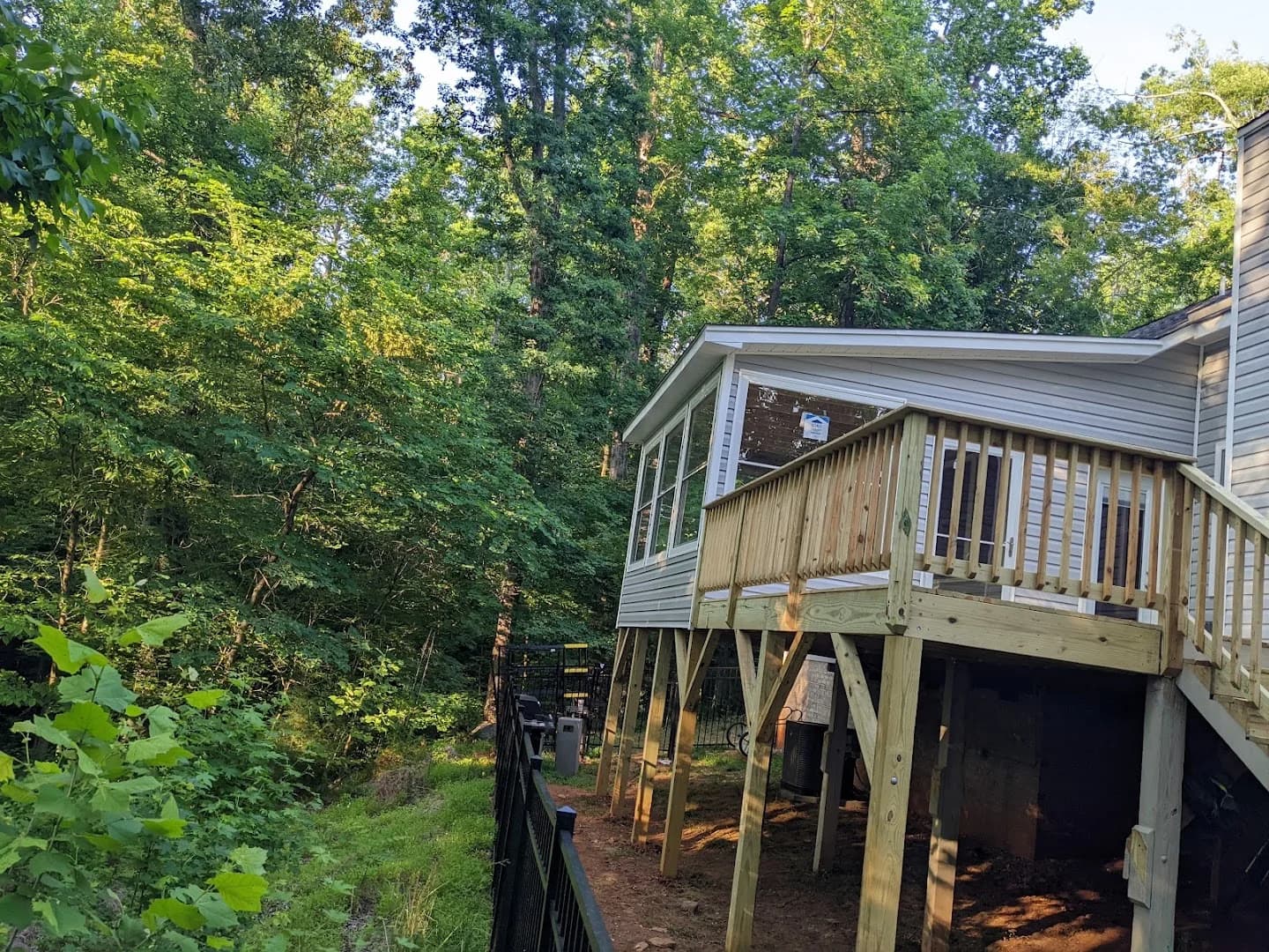 Attached roofed patio with finished posts and gutters