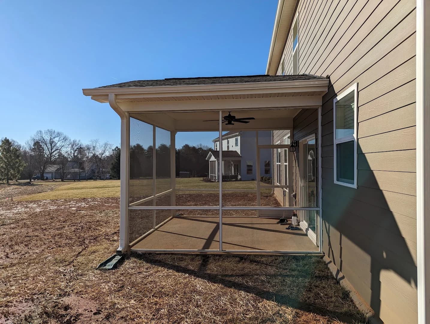 Completed elevated covered wood deck with decorative metal balusters