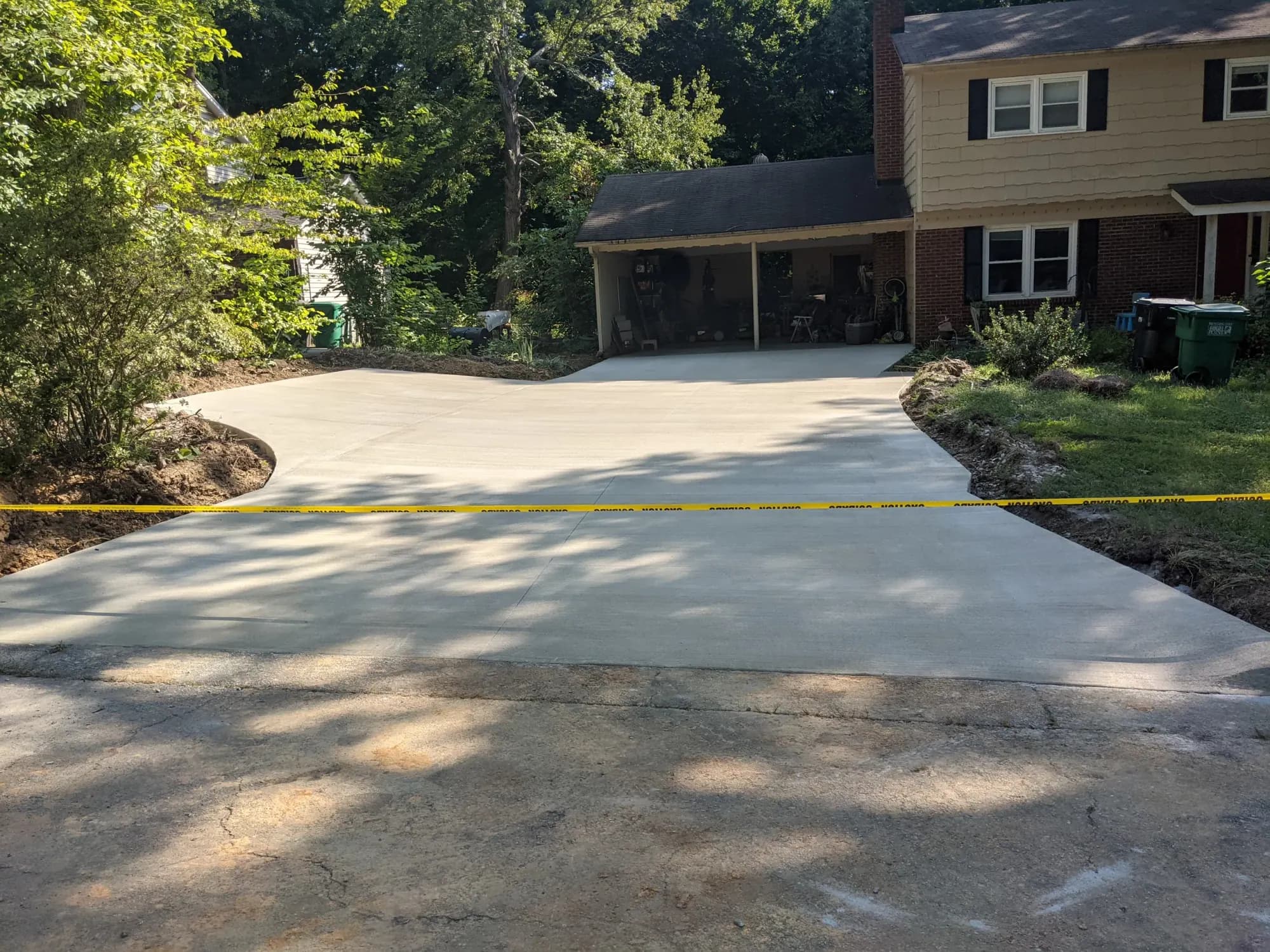 New concrete driveway with a back-up area and a broom finish in Greensboro, NC