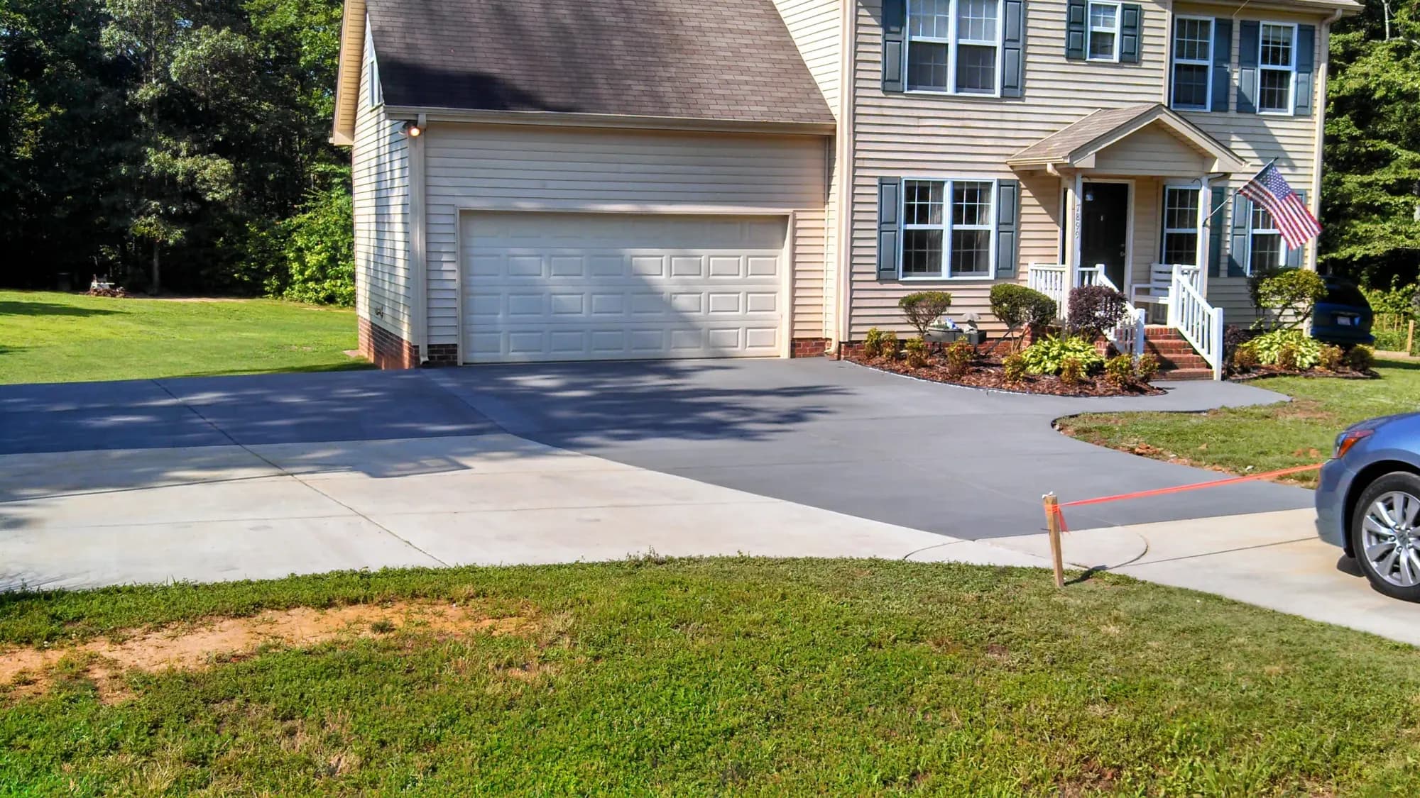 Partial concrete driveway and walkway replacement with a broom finish in Oak Ridge, NC
