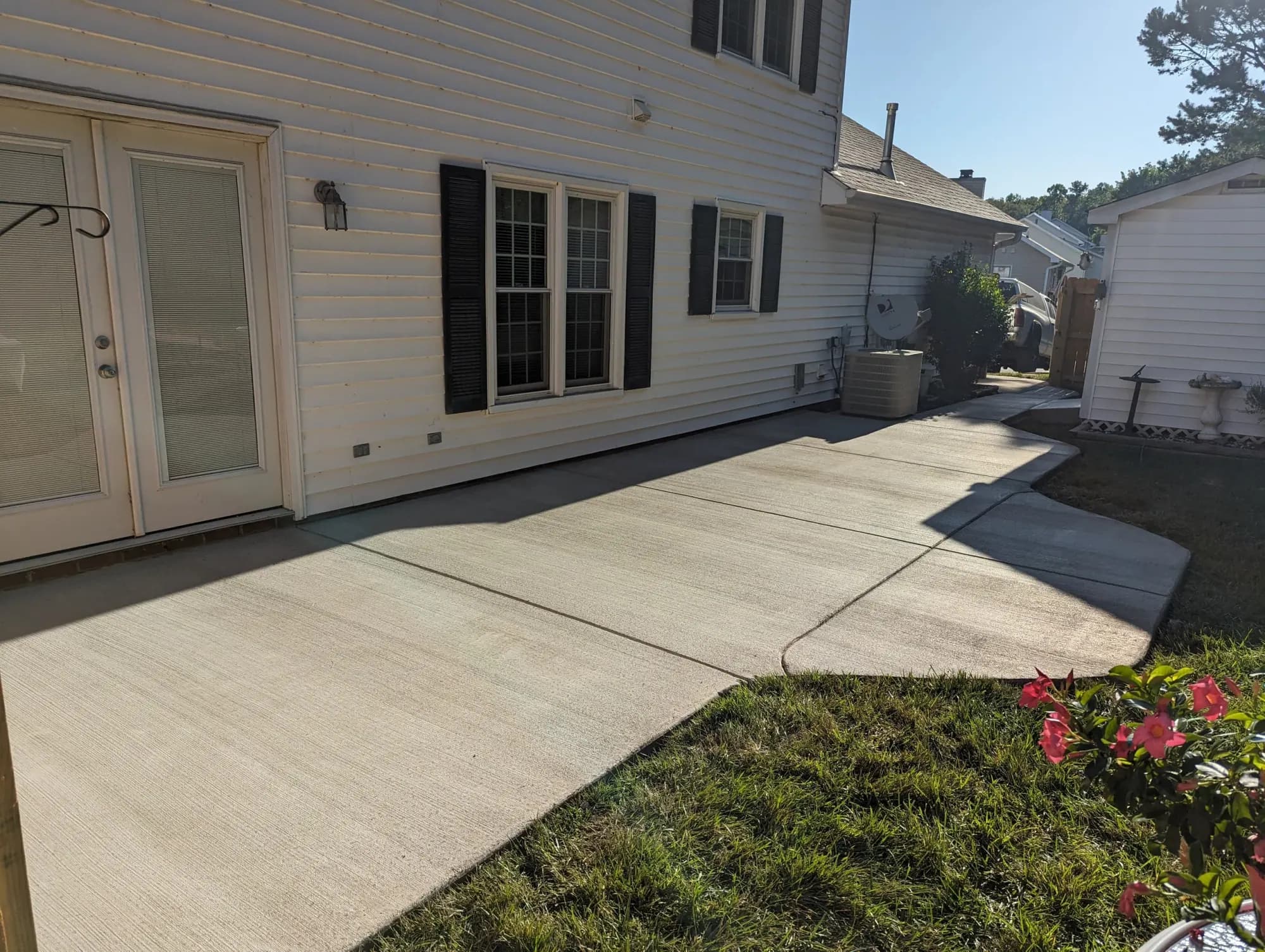 Completed broom-finished concrete patio and walkway in Greensboro, NC