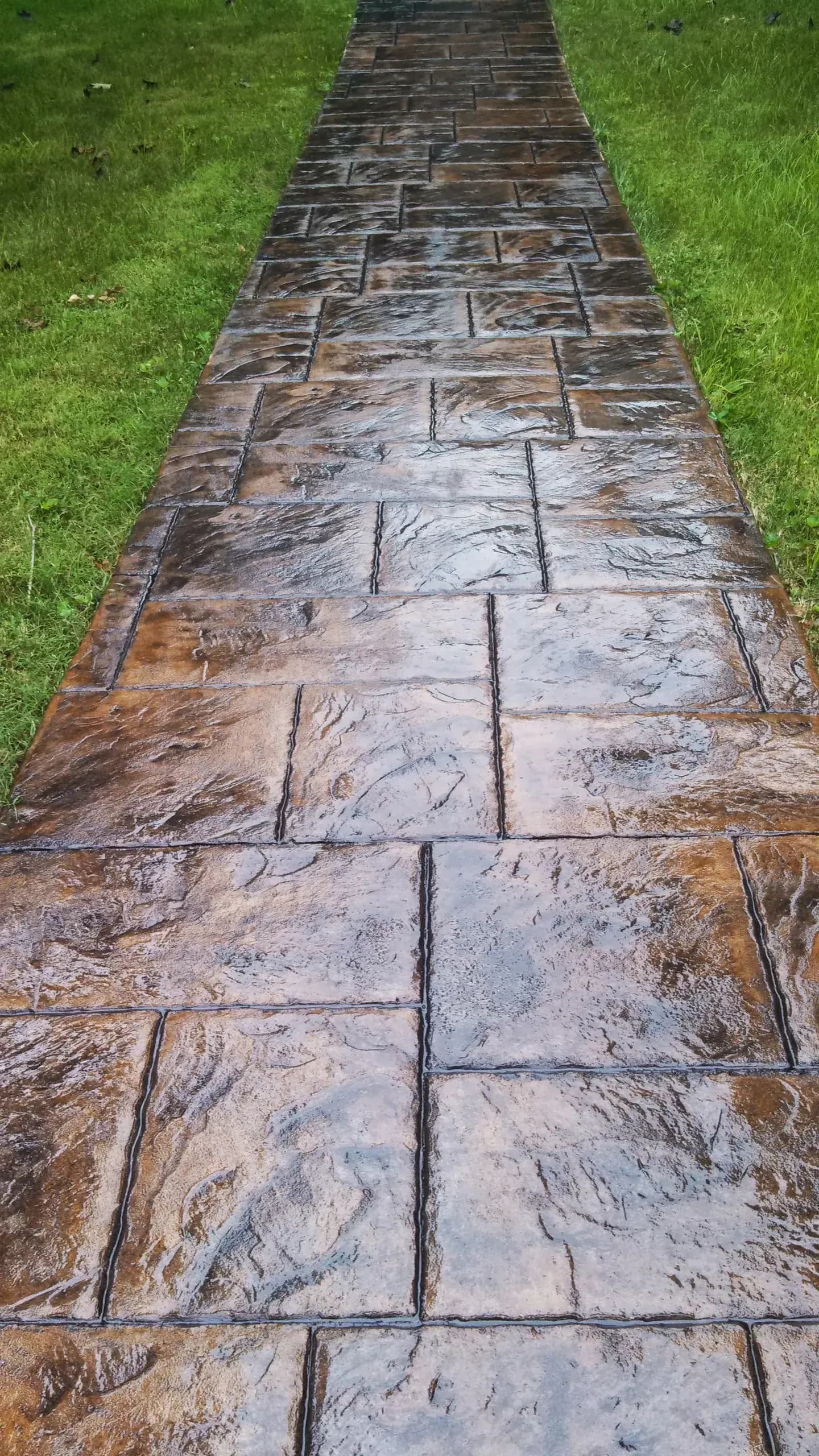 Large ashlar slate stamped concrete walkway in sand with dark gray release, Greensboro, NC