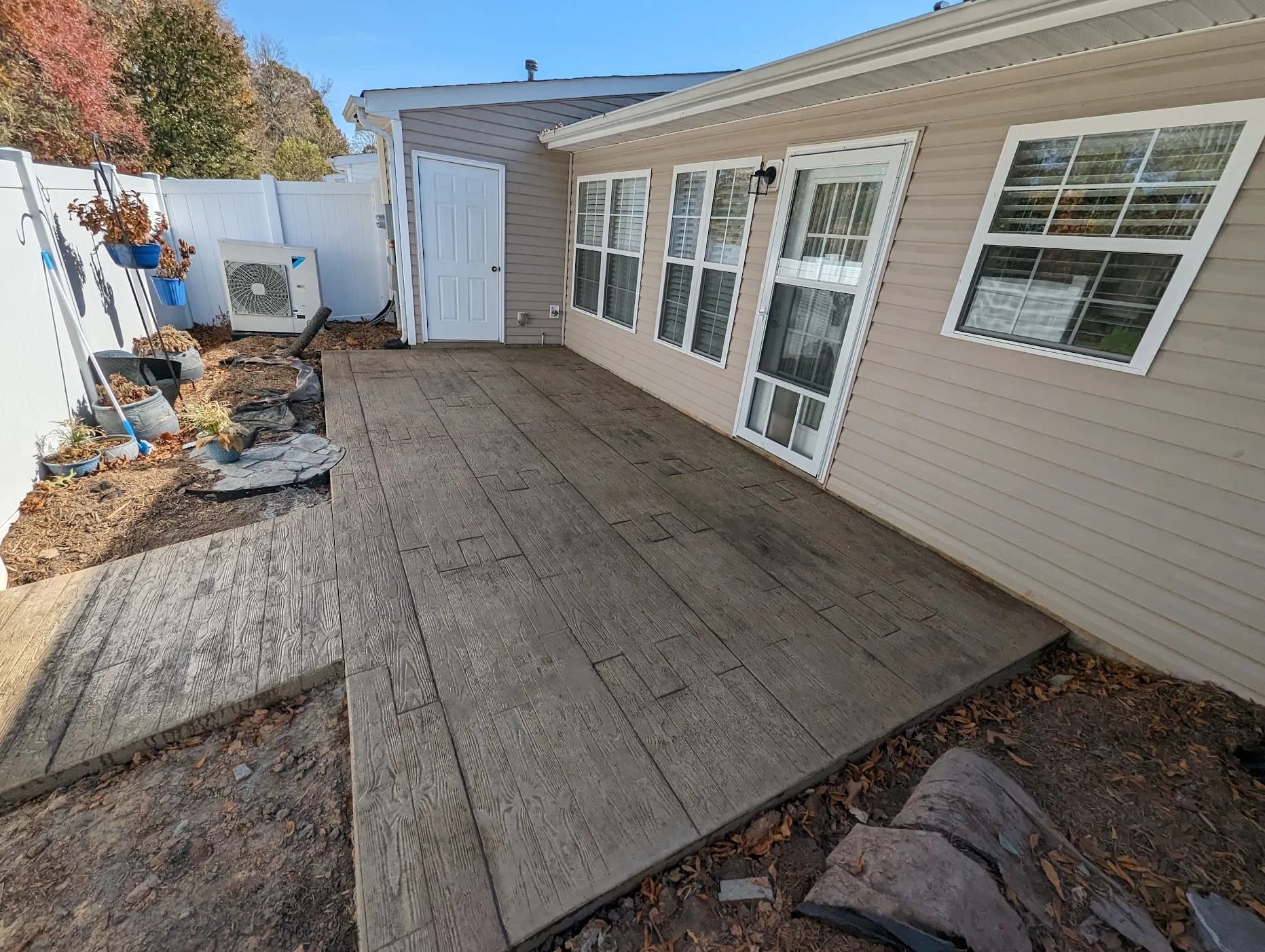 Wood plank stamped concrete patio by Page Concrete in Archdale, NC